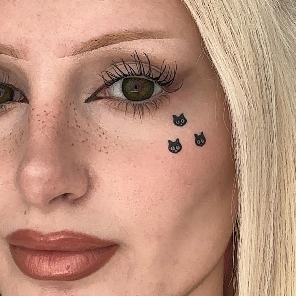 Black cat design stamp used in a graphic makeup look