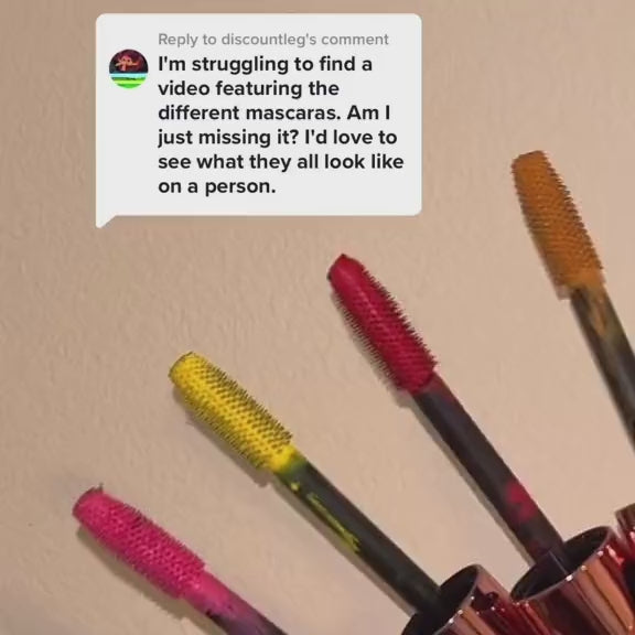 Model wearing Sunset Makeup colorful mascaras in bold shades, showing each color applied to the lashes.